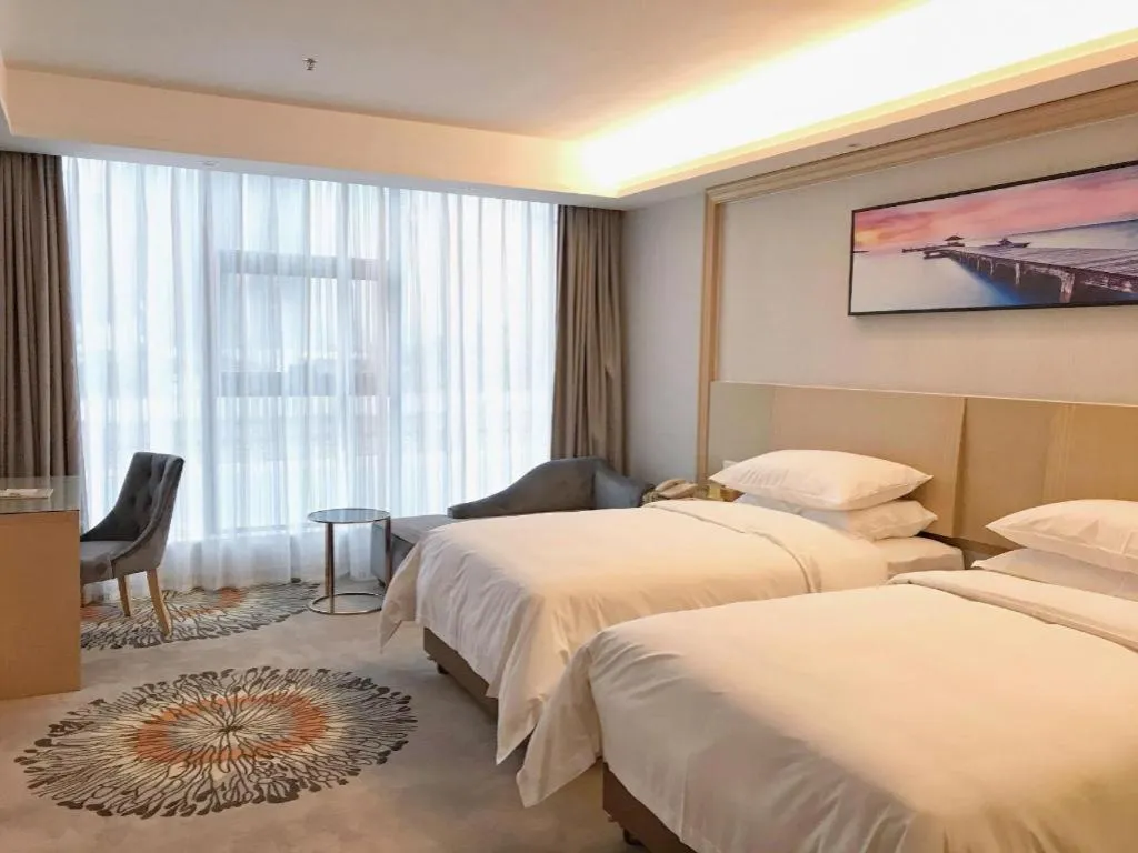 Bed in Vienna Hotel Guangzhou Huadu Financial Center Sunac Amusement Park