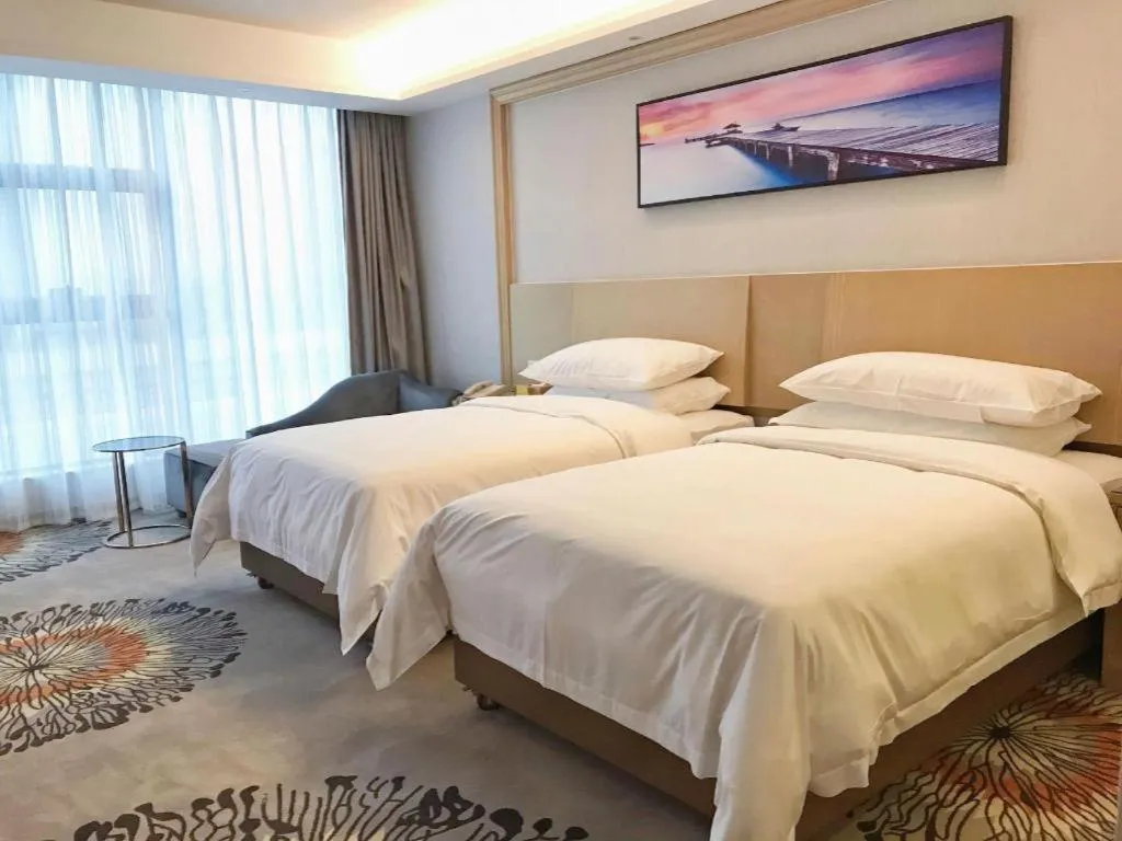Bed in Vienna Hotel Guangzhou Huadu Financial Center Sunac Amusement Park