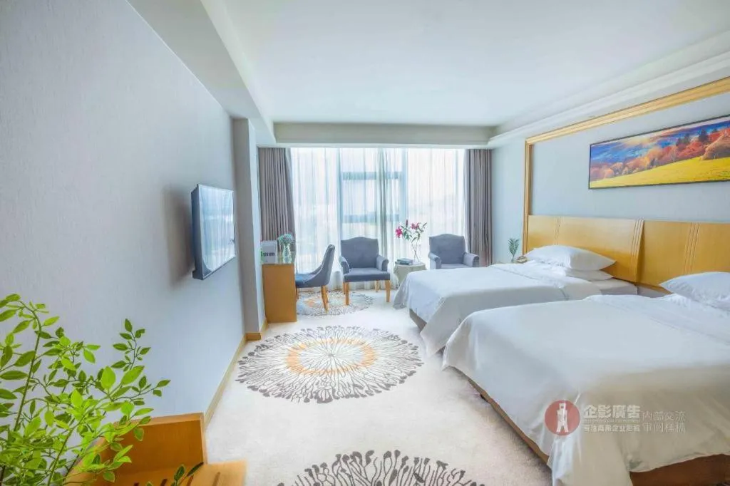 Bed in Vienna Hotel Guangzhou Huadu Financial Center Sunac Amusement Park