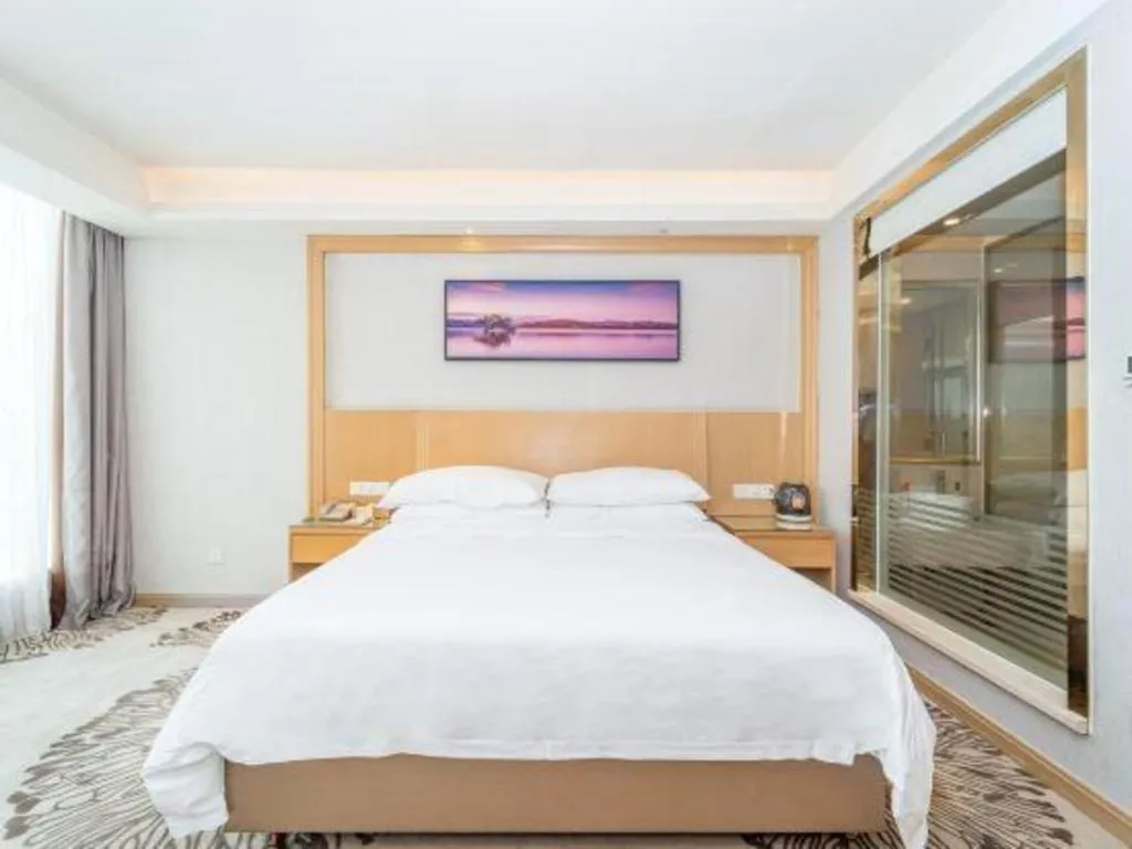 Bed in Vienna Hotel Guangzhou Huadu Financial Center Sunac Amusement Park