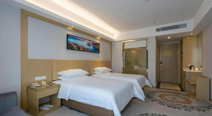 Bed in Vienna Hotel Guangzhou Huadu Financial Center Sunac Amusement Park