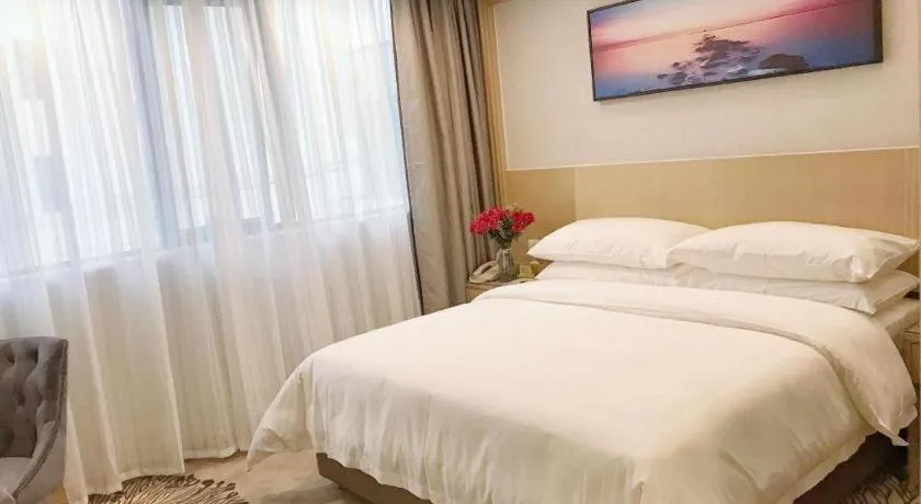 Bed in Vienna Hotel Guangzhou Huadu Financial Center Sunac Amusement Park