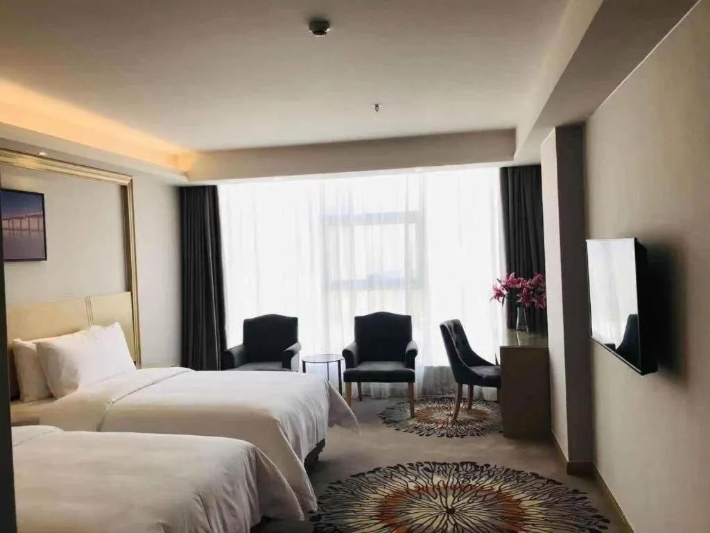 Bed in Vienna Hotel Guangzhou Huadu Financial Center Sunac Amusement Park