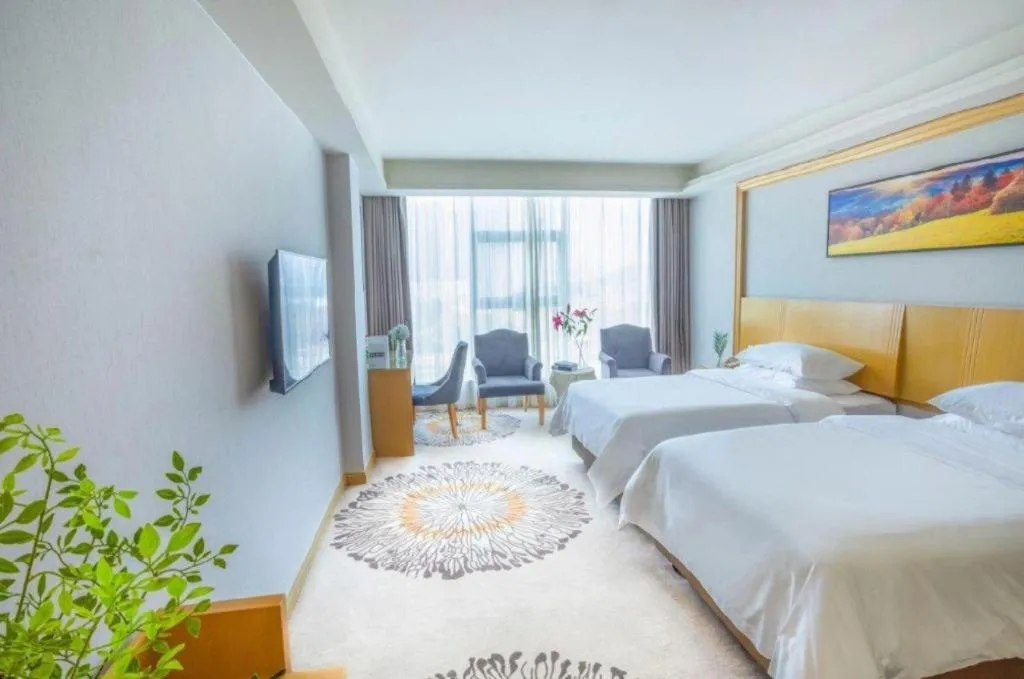 Bed in Vienna Hotel Guangzhou Huadu Financial Center Sunac Amusement Park