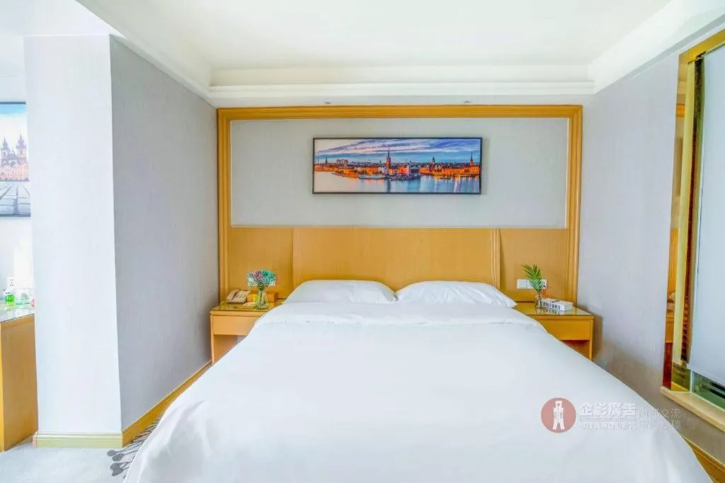Bed in Vienna Hotel Guangzhou Huadu Financial Center Sunac Amusement Park