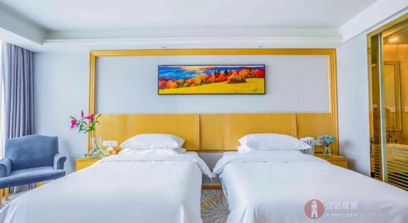 Bed in Vienna Hotel Guangzhou Huadu Financial Center Sunac Amusement Park