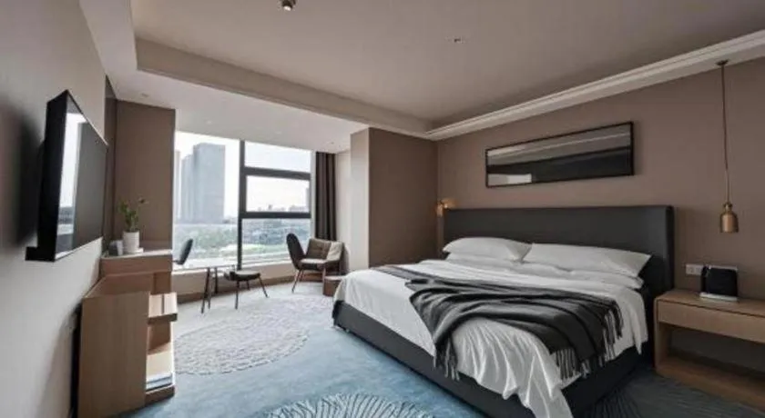Bed in Vienna Hotel Guangzhou Huadu Financial Center Sunac Amusement Park
