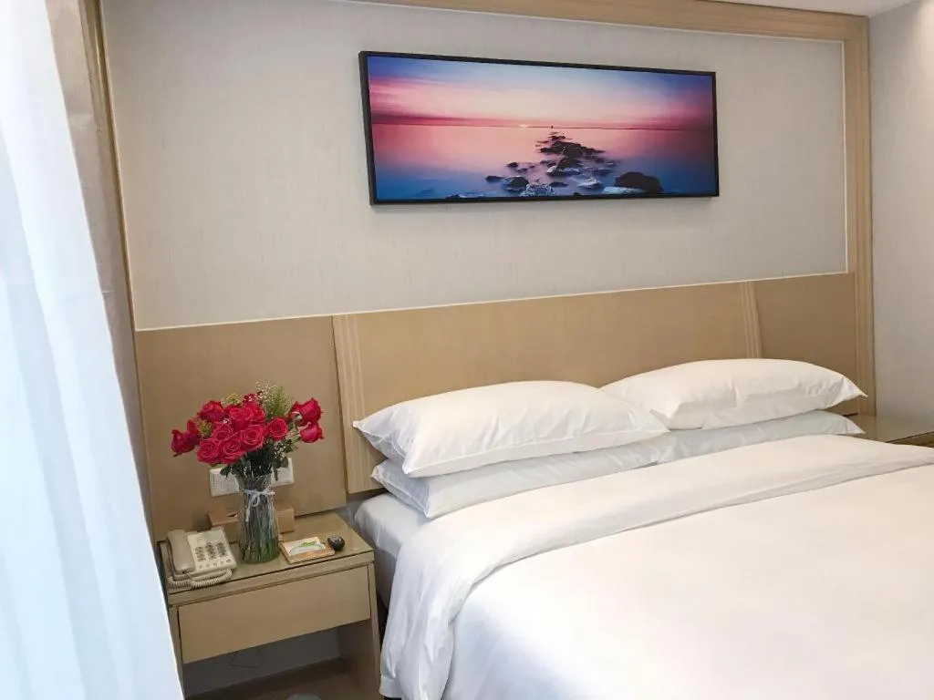 Bed in Vienna Hotel Guangzhou Huadu Financial Center Sunac Amusement Park