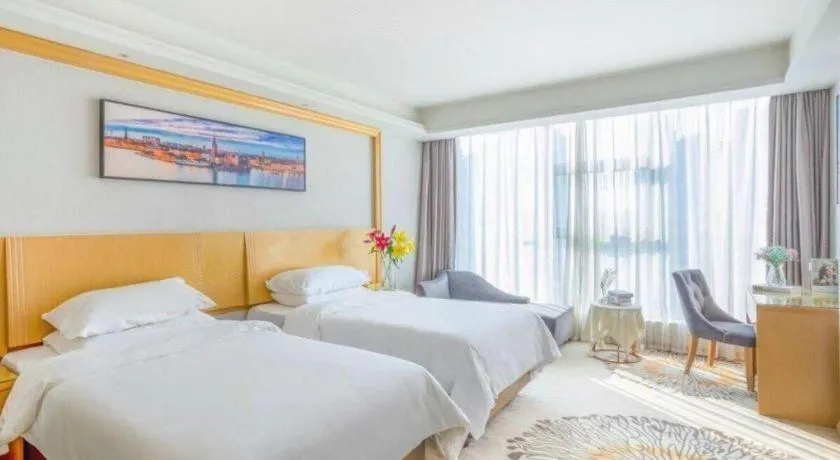 Bed in Vienna Hotel Guangzhou Huadu Financial Center Sunac Amusement Park