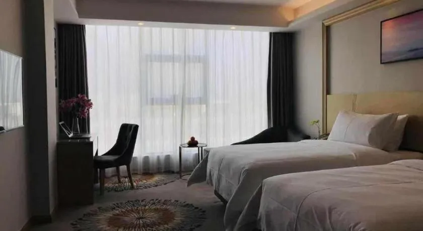 Bed in Vienna Hotel Guangzhou Huadu Financial Center Sunac Amusement Park