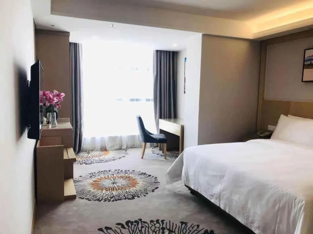 Bed in Vienna Hotel Guangzhou Huadu Financial Center Sunac Amusement Park