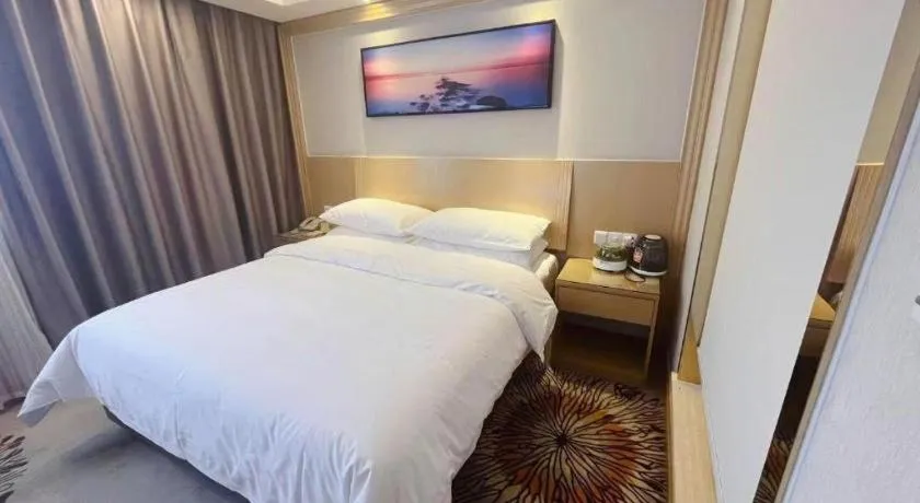 Bed in Vienna Hotel Guangzhou Huadu Financial Center Sunac Amusement Park