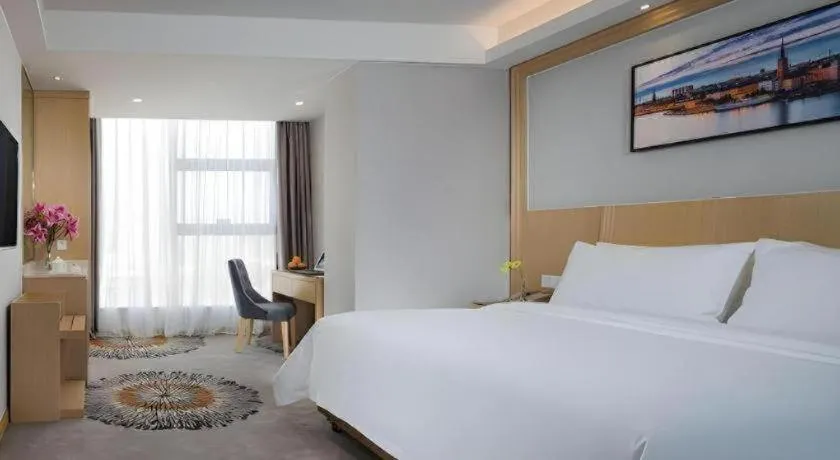 Bed in Vienna Hotel Guangzhou Huadu Financial Center Sunac Amusement Park