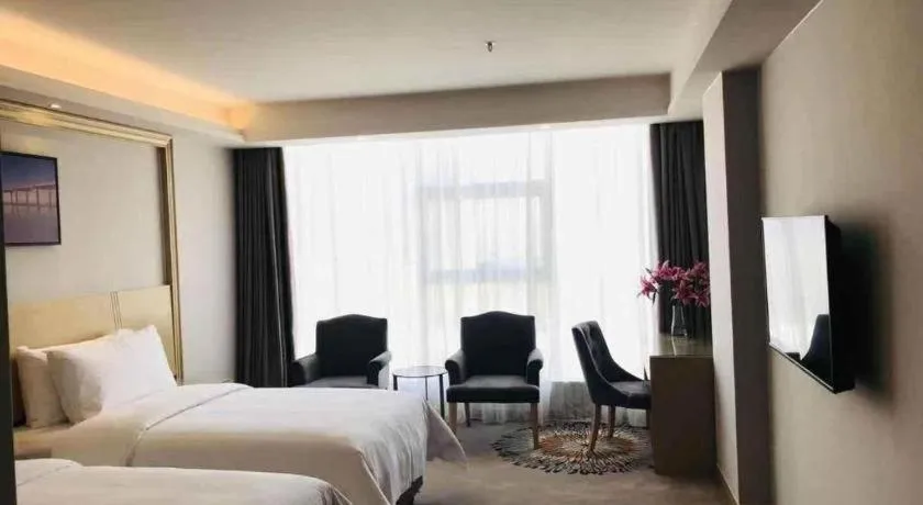 Bed in Vienna Hotel Guangzhou Huadu Financial Center Sunac Amusement Park