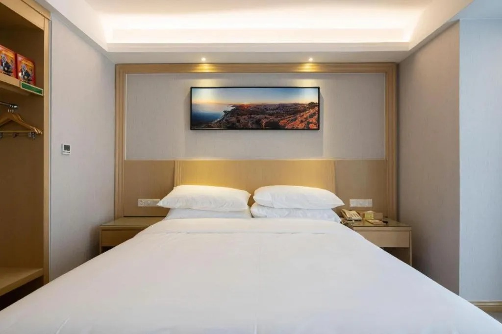 Bed in Vienna Hotel Guangzhou Huadu Financial Center Sunac Amusement Park