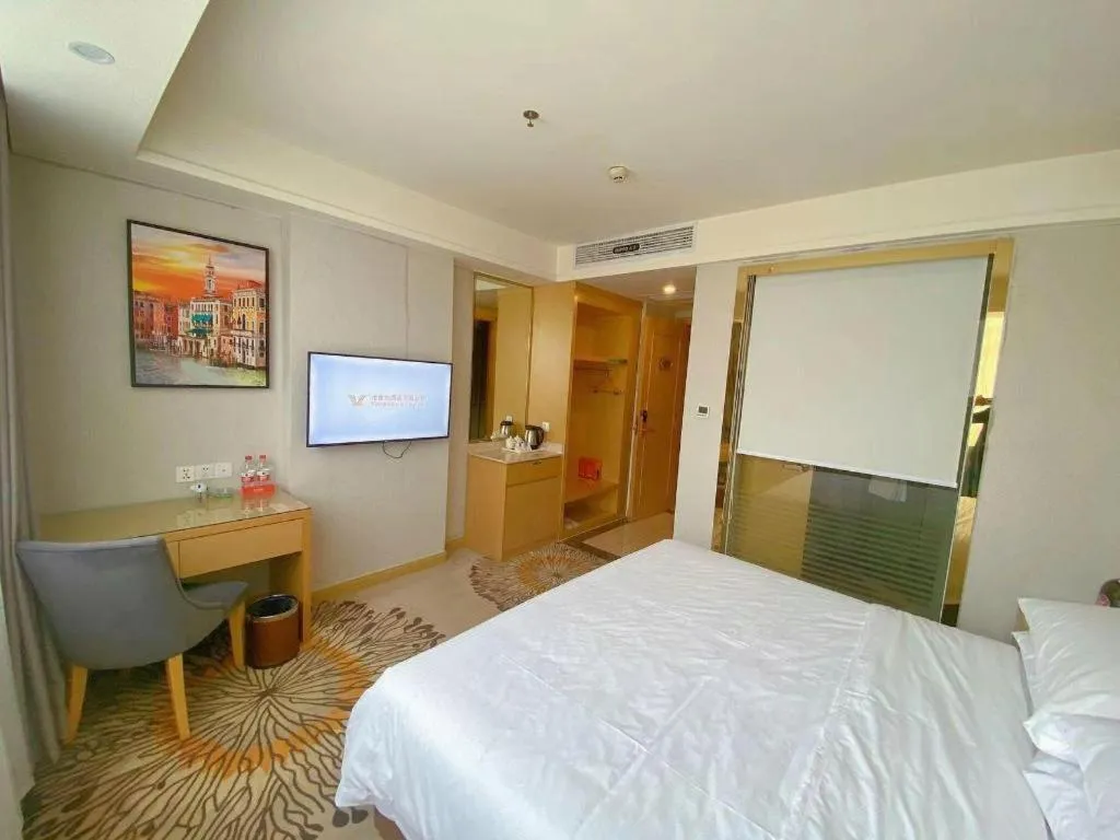 Bed in Vienna Hotel Guangzhou Huadu Financial Center Sunac Amusement Park