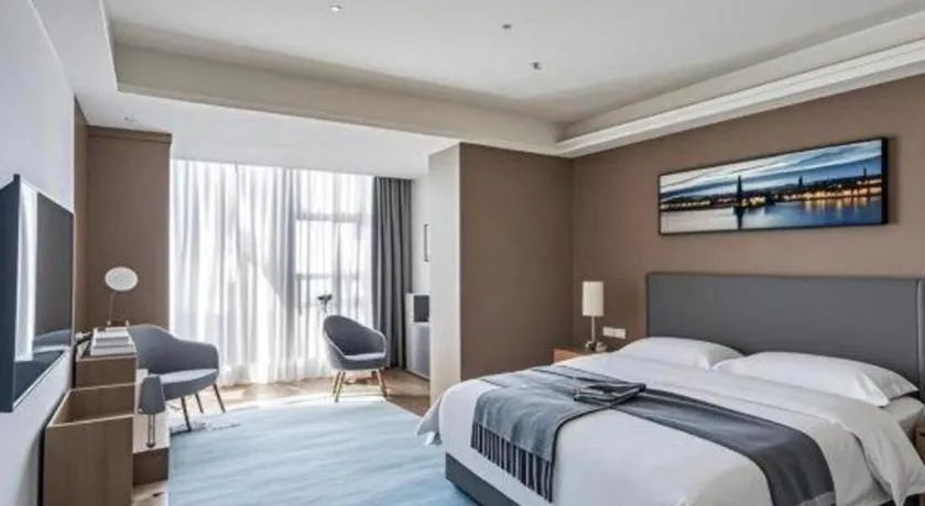 Bed in Vienna Hotel Guangzhou Huadu Financial Center Sunac Amusement Park