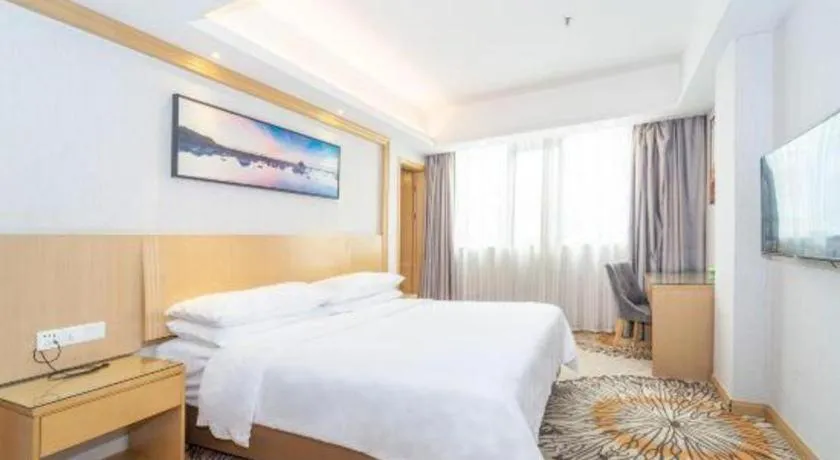 Bed in Vienna Hotel Guangzhou Huadu Financial Center Sunac Amusement Park
