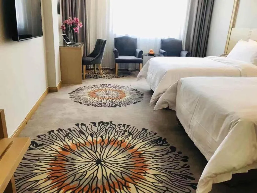 Bed in Vienna Hotel Guangzhou Huadu Financial Center Sunac Amusement Park