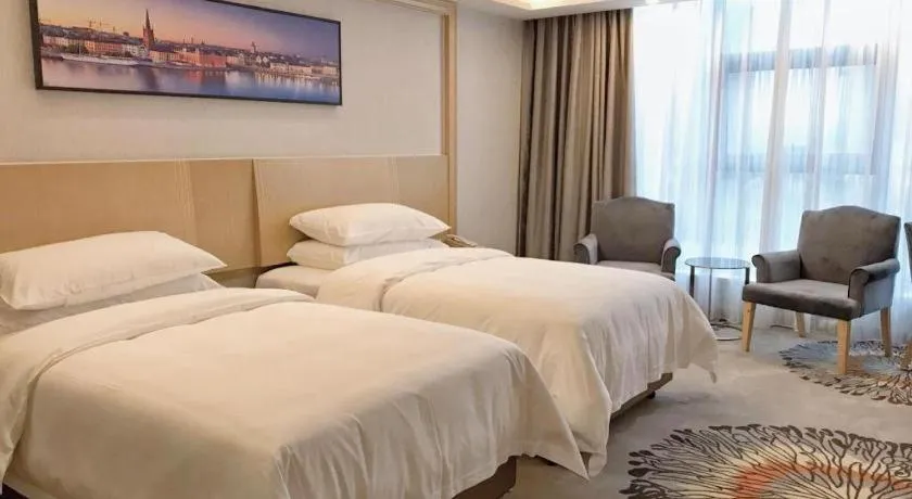 Bed in Vienna Hotel Guangzhou Huadu Financial Center Sunac Amusement Park