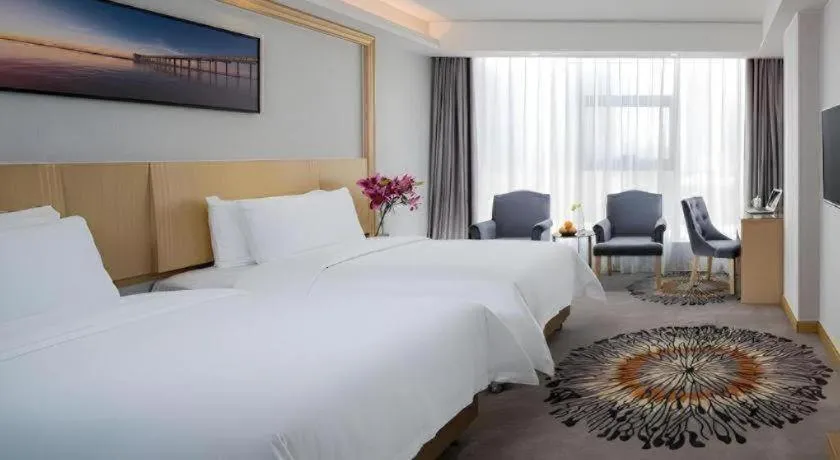Bed in Vienna Hotel Guangzhou Huadu Financial Center Sunac Amusement Park