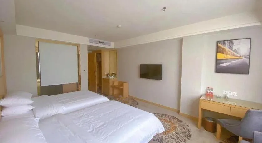Bed in Vienna Hotel Guangzhou Huadu Financial Center Sunac Amusement Park