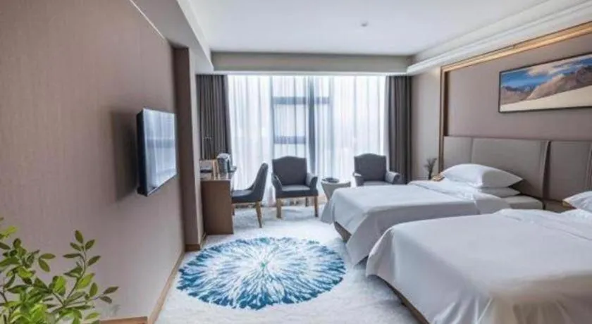 Bed in Vienna Hotel Guangzhou Huadu Financial Center Sunac Amusement Park