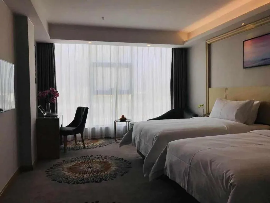 Bed in Vienna Hotel Guangzhou Huadu Financial Center Sunac Amusement Park