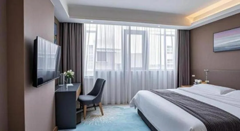 Bed in Vienna Hotel Guangzhou Huadu Financial Center Sunac Amusement Park