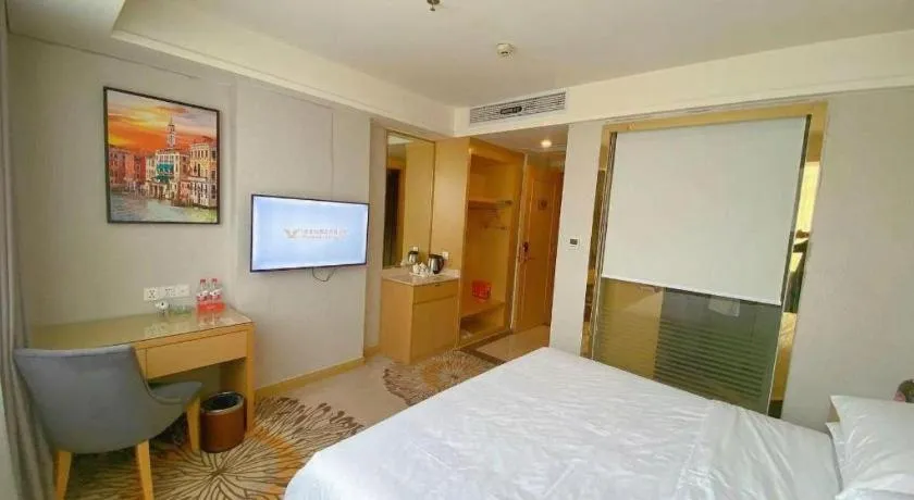 Bed in Vienna Hotel Guangzhou Huadu Financial Center Sunac Amusement Park