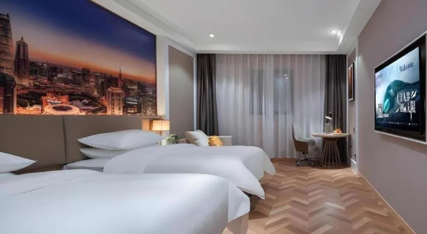 Bed in Vienna Hotel Jiangsu Dongtai Wanghai West Road