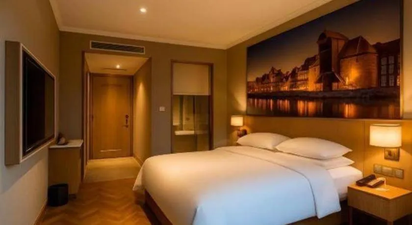 Bed in Vienna Hotel Jiangsu Dongtai Wanghai West Road