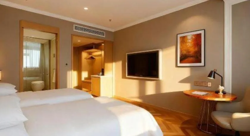 Bed in Vienna Hotel Jiangsu Dongtai Wanghai West Road