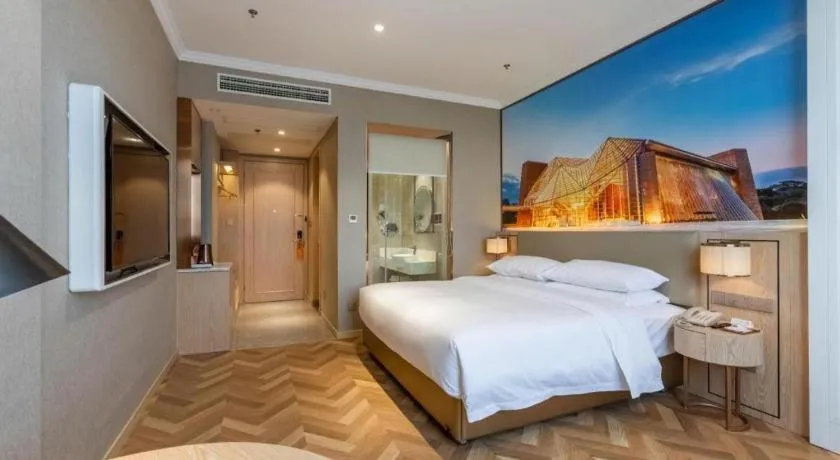 Bed in Vienna Hotel Jiangsu Dongtai Wanghai West Road