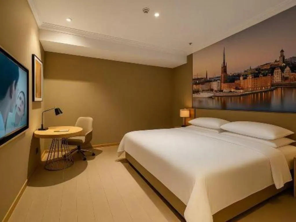 Bed in Vienna Hotel Jiangsu Dongtai Wanghai West Road