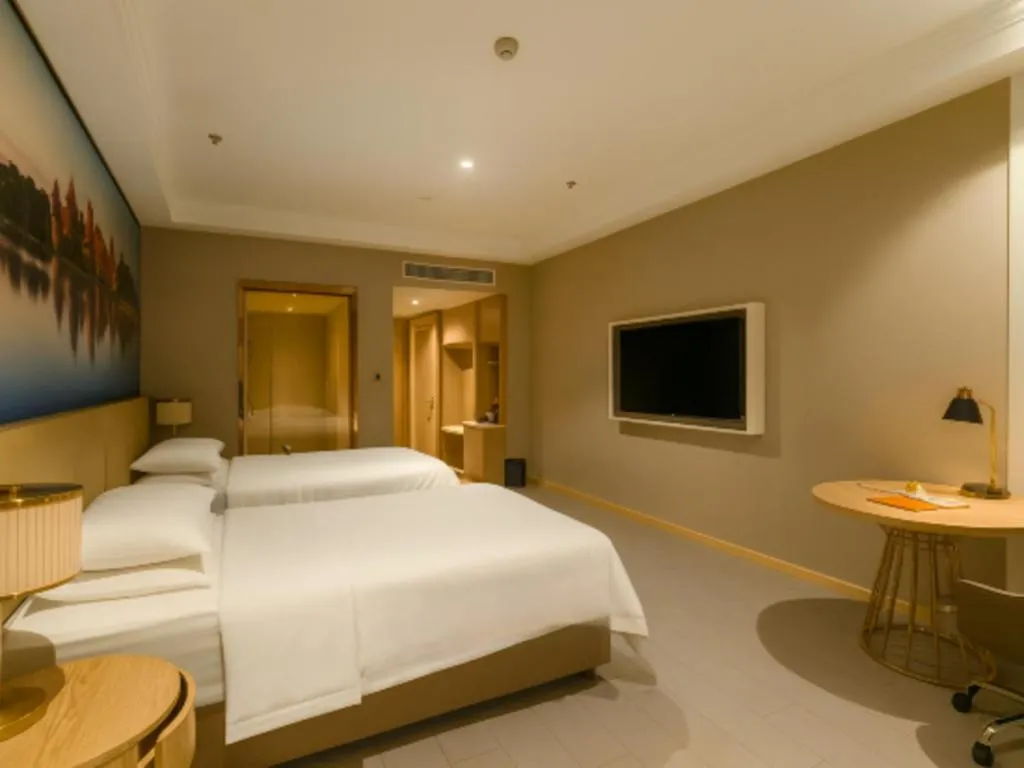 Bed in Vienna Hotel Jiangsu Dongtai Wanghai West Road