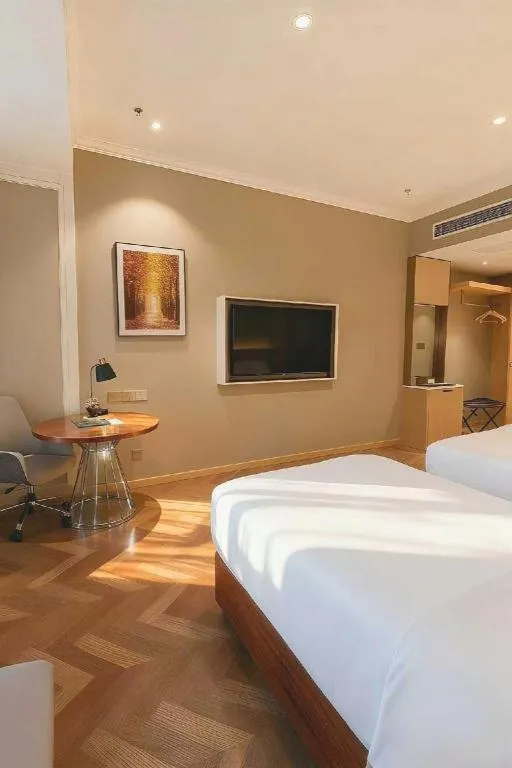 Bed in Vienna Hotel Jiangsu Dongtai Wanghai West Road