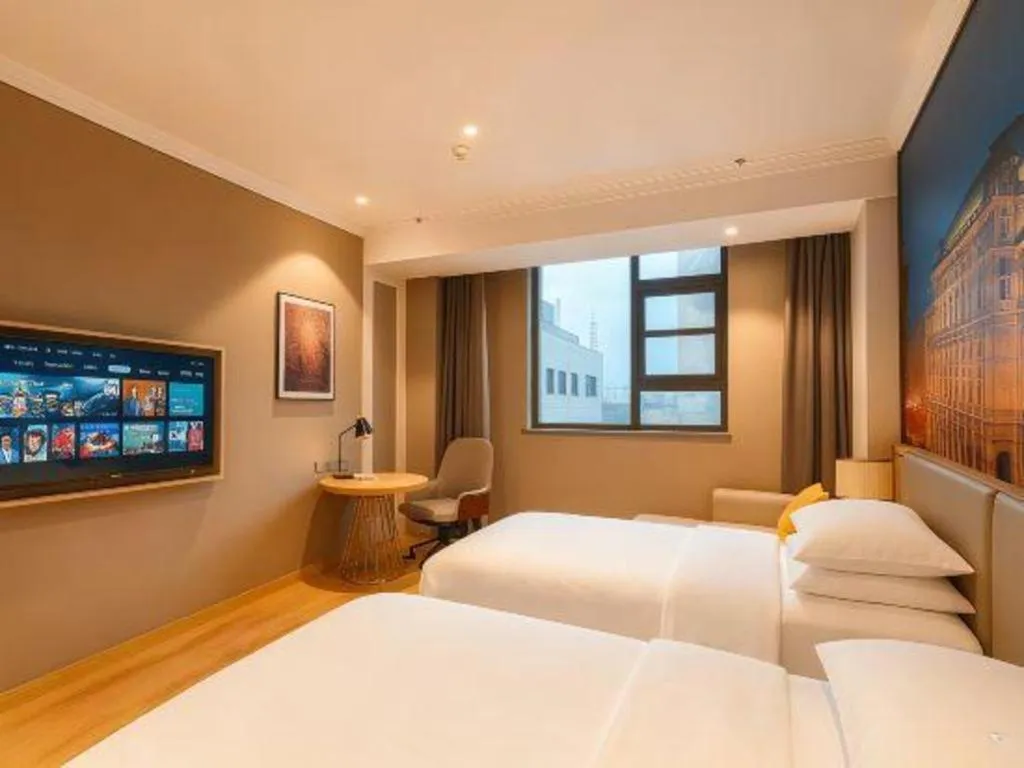 Bed in Vienna Hotel Jiangsu Dongtai Wanghai West Road