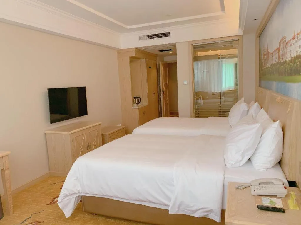 Bed in Vienna Hotel Shenzhen Window of the World Qiaochengdong Metro Station