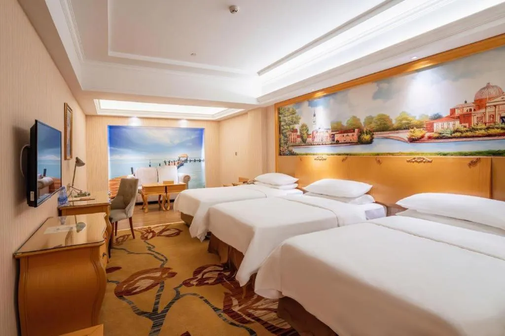 Bed in Vienna Hotel Guangdong Meizhou Fengshun