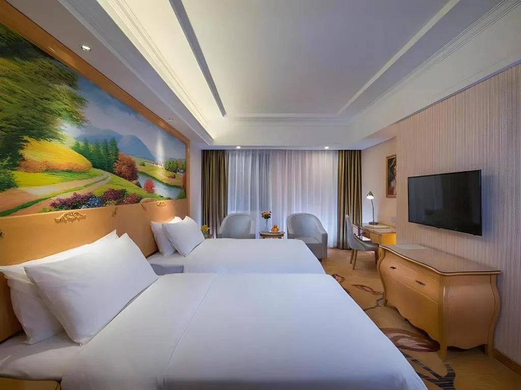 Bed in Vienna Hotel Guangdong Meizhou Fengshun