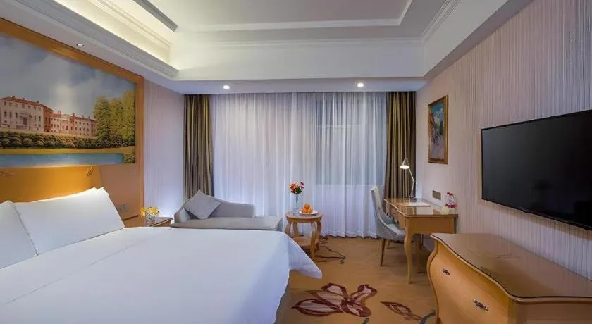 Bed in Vienna Hotel Guangdong Meizhou Fengshun