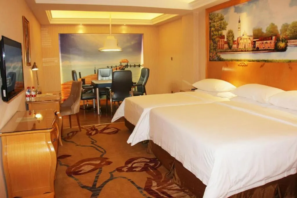 Bed in Vienna Hotel Guangdong Meizhou Fengshun