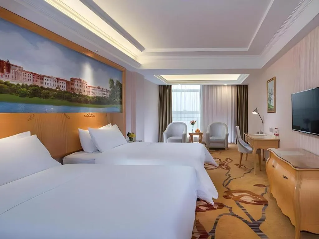 Bed in Vienna Hotel Guangdong Meizhou Fengshun