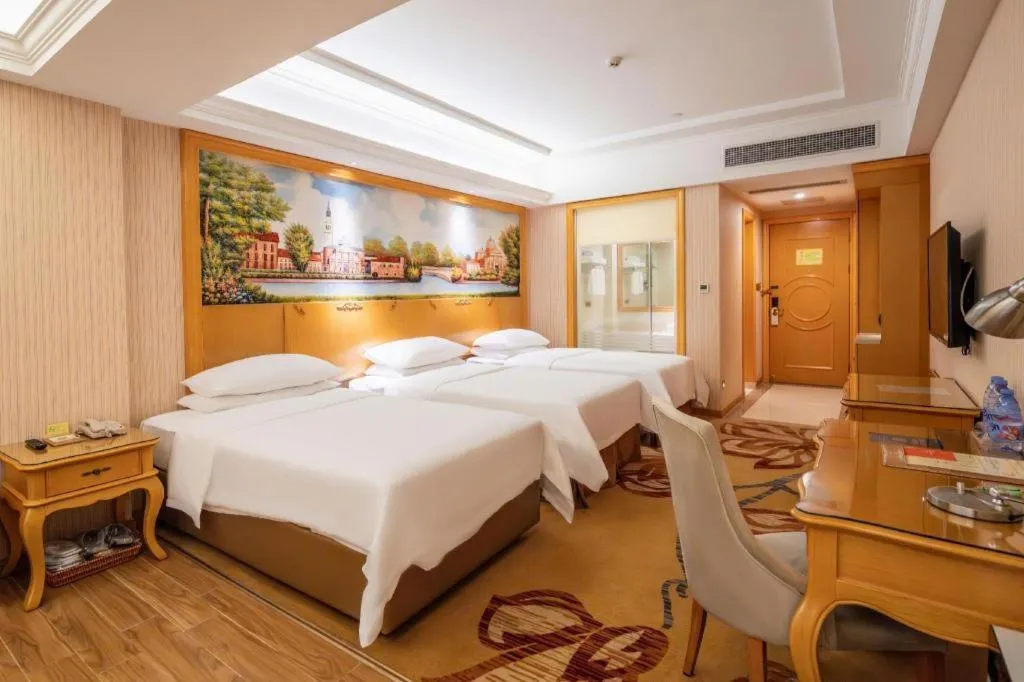 Bed in Vienna Hotel Guangdong Meizhou Fengshun