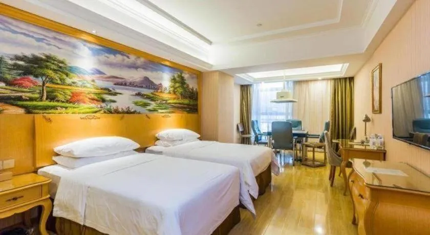 Bed in Vienna Hotel Guangdong Meizhou Fengshun