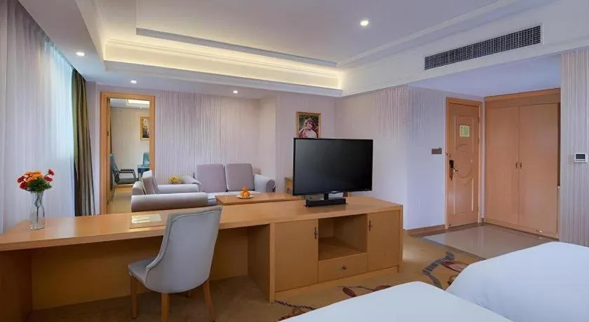 Bed in Vienna Hotel Guangdong Meizhou Fengshun