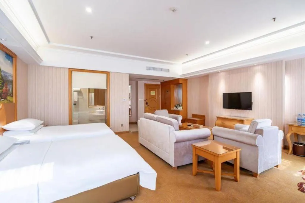 Bed in Vienna Hotel Guangdong Meizhou Fengshun