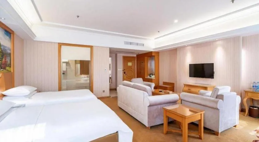 Bed in Vienna Hotel Guangdong Meizhou Fengshun