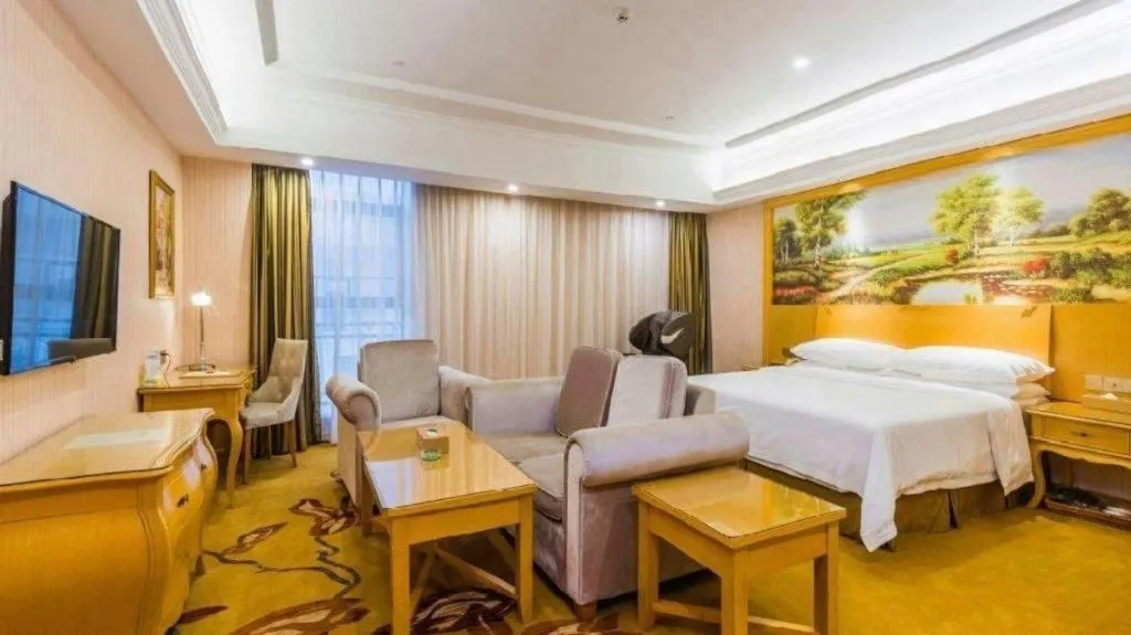 Bed in Vienna Hotel Guangdong Meizhou Fengshun